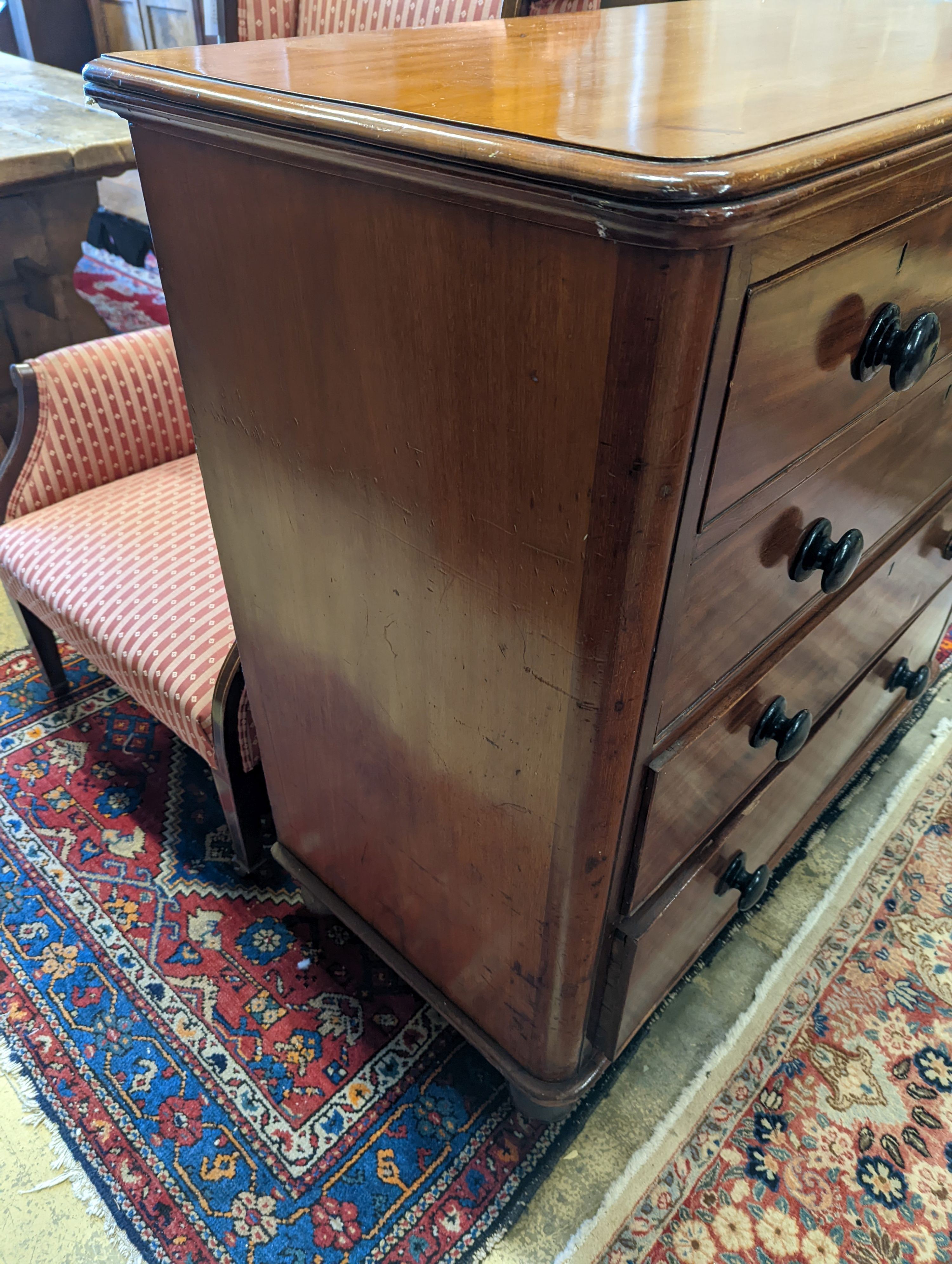 A mahogany chest of two short and three long drawers with turned handles, width 105cm, depth 53cm, height 106cm